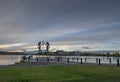 A Group of People in Somba KÃ¢â¬â¢e Park on Frame Lake at sunset